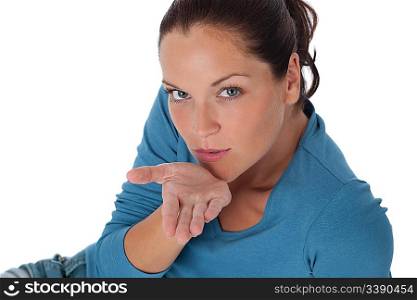 Brown hair woman blowing a kiss on white background