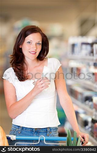 Brown hair woman buying shampoo