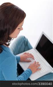 Brown hair woman with laptop on white background
