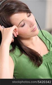 brown-haired girl listening to music