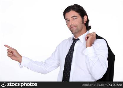 brown-haired man pointing with finger