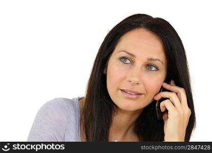 Brown-haired woman on phone