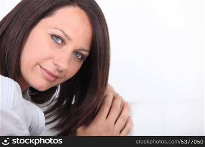 Brown-haired woman with blue eyes
