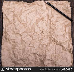 brown kraft paper and black wooden pencil, empty space