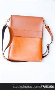 brown leather bag on white background