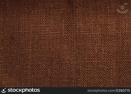 Brown linen texture closeup. Backdrop for design