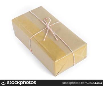 Brown mail package parcel wrap delivery tied up with string and adhesive tape on white background