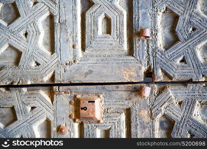 brown morocco in africa the old wood facade home and rusty safe padlock