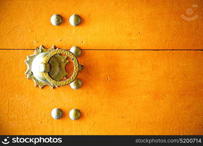 brown morocco in africa the old wood facade home and rusty safe padlock