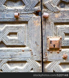 brown morocco in africa the old wood facade home and rusty safe padlock