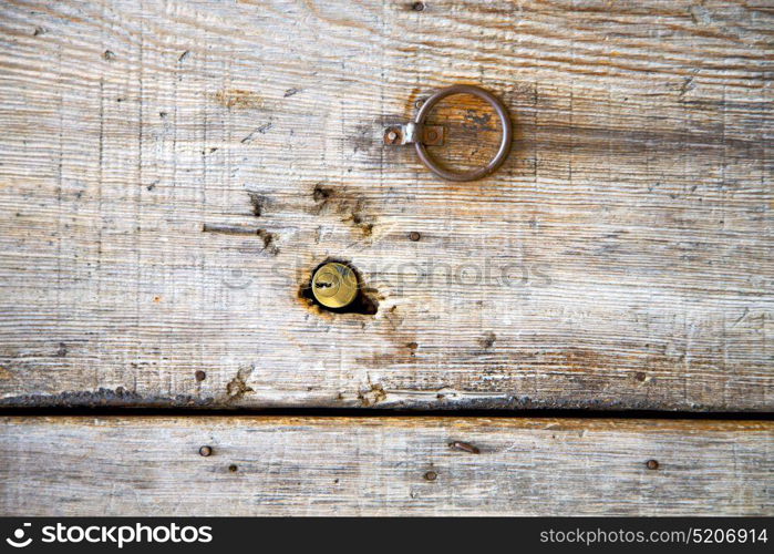 brown morocco in africa the old wood facade home and rusty safe padlock