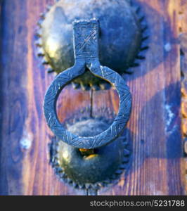 brown morocco in africa the old wood facade home and rusty safe padlock