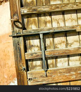 brown morocco in africa the old wood facade home and rusty safe padlock