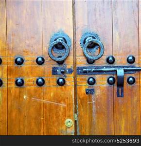 brown morocco in africa the old wood facade home and rusty safe padlock
