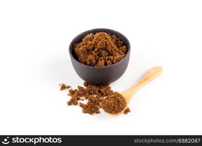 brown muscovado sugar in bowl isolated on white background