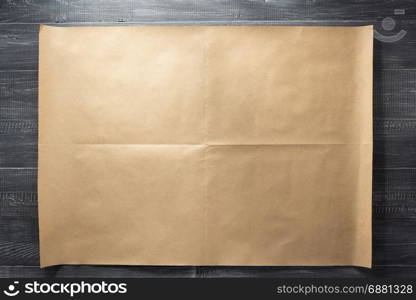 brown of paper at wooden background texture