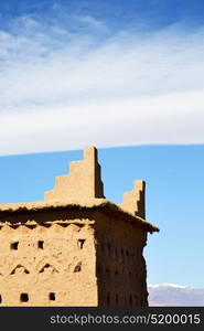 brown old construction in africa morocco and clouds near the tower