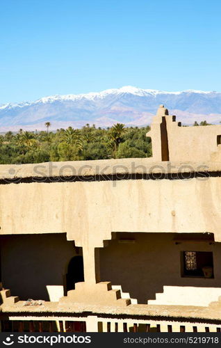 brown old construction in africa morocco and clouds near the tower