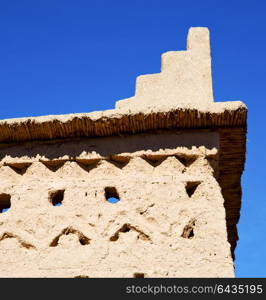 brown old construction in africa morocco and clouds near the tower