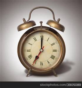 Brown old style alarm clock with shadow