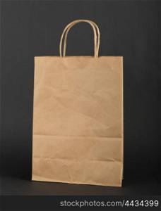 Brown paper bag on a black background