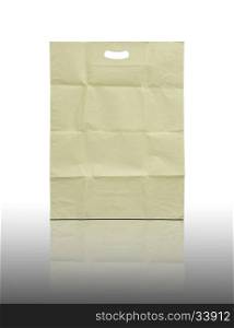 Brown paper bag on reflect floor and white background
