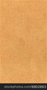 Brown paper texture background - vertical. Brown paper texture useful as a background - vertical
