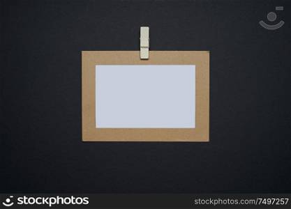 Brown picture frame and white blank picture on black background