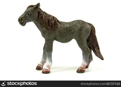 brown plastic horse isolated on white background