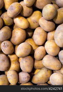 Brown potatoes pattern in a market display in mediterranean