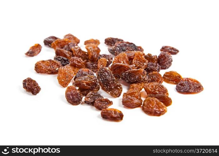 brown raisins on a white background