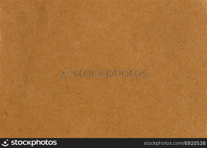Brown recycled cardboard paper abstract background texture.
