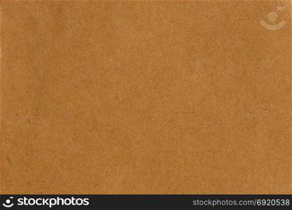 Brown recycled cardboard paper abstract background texture.