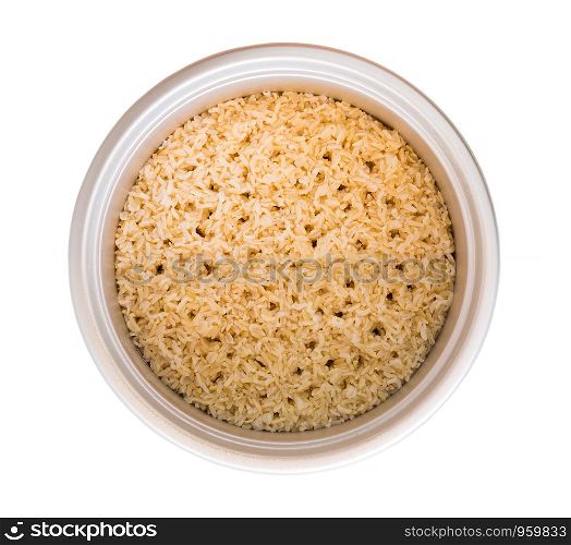 Brown rice in a pot isolated on white background.