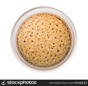 Brown rice in a pot isolated on white background.