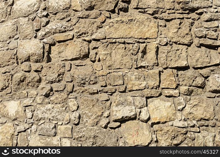 Brown rough stone wall surface texture of ancient building