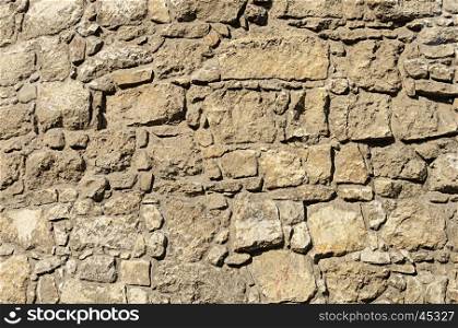 Brown rough stone wall surface texture of ancient building