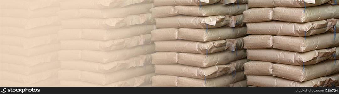 Brown sacks store in industrial warehouse. Background with copy space