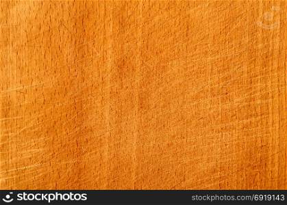 Brown scratched wooden cutting board. Wood texture