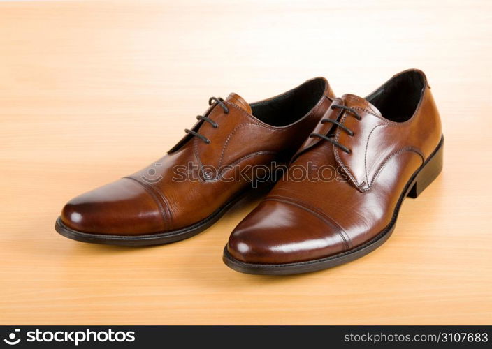 Brown shoes on wooden table