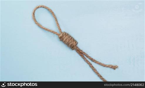 brown solid rope with difficult knot