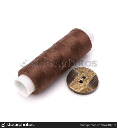 Brown spool of thread isolated on white background