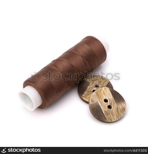 Brown spool of thread isolated on white background