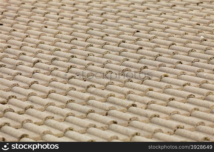 Brown stone tiles roof texture architecture background, detail of house close up