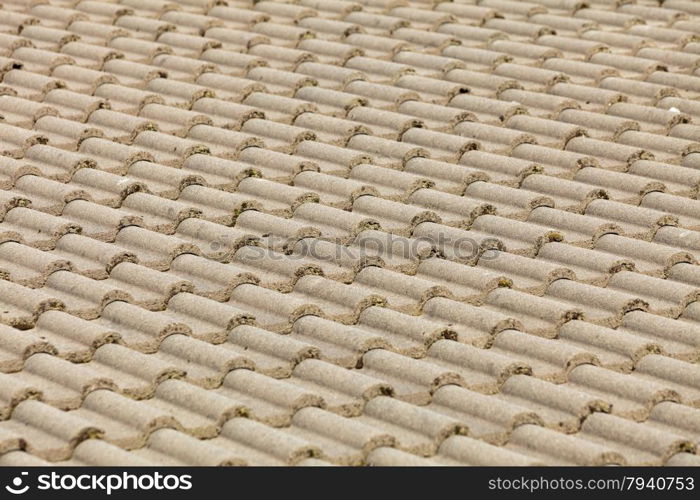 Brown stone tiles roof texture architecture background, detail of house close up