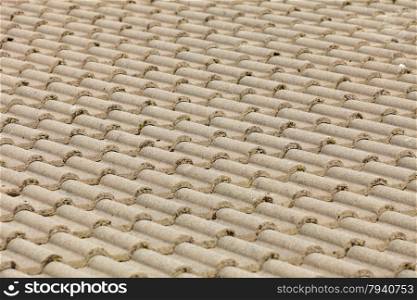 Brown stone tiles roof texture architecture background, detail of house close up