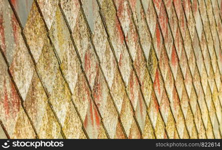 Brown stone tiles roof texture architecture background seamless pattern, detail of house close up. stone roof pattern background