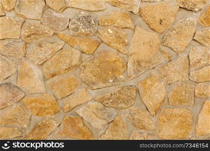 Brown stone wall to use as wallpaper
