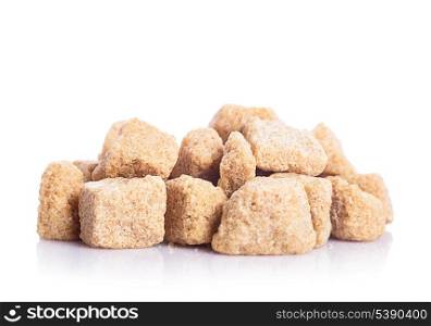Brown sugar cubes in heap isolated on white
