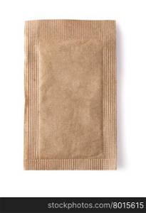 Brown sugar packet on white background isolated with clipping path